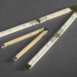 2 Diverse Zollstöcke: 6 in. "Parkins & Gotto" (London um 1860) und 12 in., klappbar mit Metallmontierung, Wahlzahn bzw. Bein/Walzahn, 19.Jh., L. 8/15,4cm und 8,3/30,5cm, min. Alters- und Gebrauchsspuren - photo 1