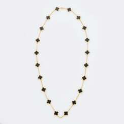 Van Cleef & Arpels. Langes Gold-Onyx Collier 'Alhambra 20 Motive'.
