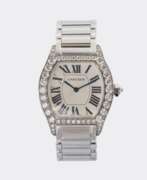 Overview. Cartier. Damen-Armbanduhr 'Tortue' mit Brillanten.