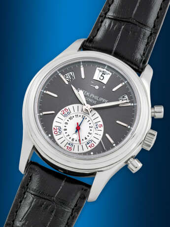 PATEK PHILIPPE. A PLATINUM AUTOMATIC ANNUAL CALENDAR FLYBACK CHRONOGRAPH WRISTWATCH WITH POWER RESERVE AND DAY/NIGHT INDICATION - photo 2