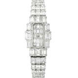 VACHERON CONSTANTIN. A LADY`S MESMERISING AND ATTRACTIVE 18K WHITE GOLD AND EMERALD-CUT DIAMOND-SET BRACELET WATCH - фото 1