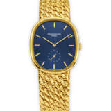 PATEK PHILIPPE. AN ATTRACTIVE 18K GOLD BRACELET WRISTWATCH - Foto 1