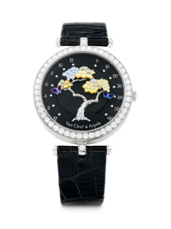 VAN CLEEF & ARPELS. A LADY`S ELEGANT 18K WHITE GOLD AND DIAMOND-SET BI-RETROGRADE WRISTWATCH WITH MOTHER-OF-PEARL - фото 1