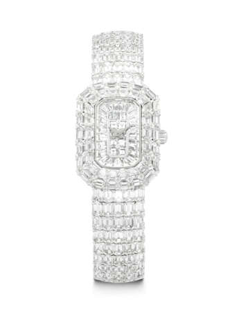 PIAGET. A MESMERISING 18K WHITE GOLD AND BAGUETTE-CUT DIAMOND-SET BRACELET WATCH - фото 1