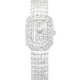 PIAGET. A MESMERISING 18K WHITE GOLD AND BAGUETTE-CUT DIAMOND-SET BRACELET WATCH - фото 1