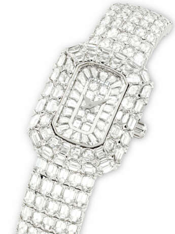 PIAGET. A MESMERISING 18K WHITE GOLD AND BAGUETTE-CUT DIAMOND-SET BRACELET WATCH - фото 2