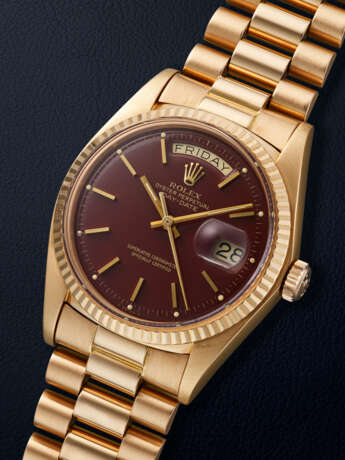 ROLEX, PINK GOLD 'DAY-DATE', WITH OXBLOOD LACQUERED 'STELLA' DIAL, REF. 1803 - photo 2