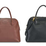 A SET OF TWO: A BLACK CALF BOX LEATHER BOLIDE 31 & A NOISETTE COURCHEVEL BOLIDE 31 WITH GOLD HARDWARE - photo 1