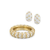 SCHLUMBERGER FOR TIFFANY & CO., WHITE ENAMEL ‘DOT LOSANGE’ BANGLE BRACELET AND 'BANANA' EARRINGS - photo 1