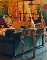 Annette Kelm. Reading a book about Robert Stacy-Judd