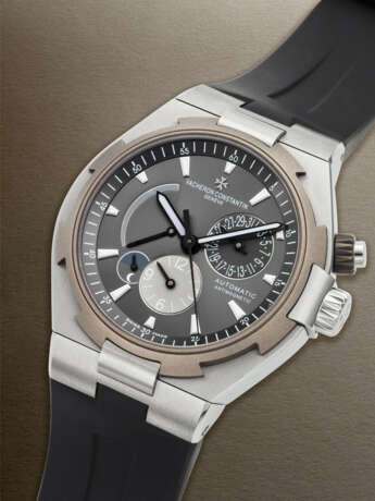 VACHERON CONSTANTIN, STAINLESS STEEL AND TITANIUM 'OVERSEAS DUAL TIME' WITH POWER RESERVE AND DATE, REF. 47450/000W-9511 - photo 2 VACHERON CONSTANTIN, STAINLESS STEEL AND TITANIUM 'OVERSEAS DUAL TIME' WITH POWER RESERVE AND DATE, REF. 47450/000W-9511 - photo 2