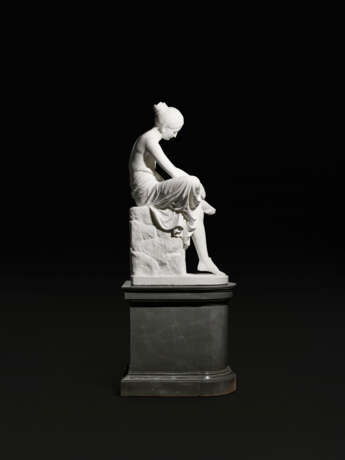 A WHITE MARBLE FIGURE OF THE SANDAL BINDER (SANDALBINDERIN) - photo 4