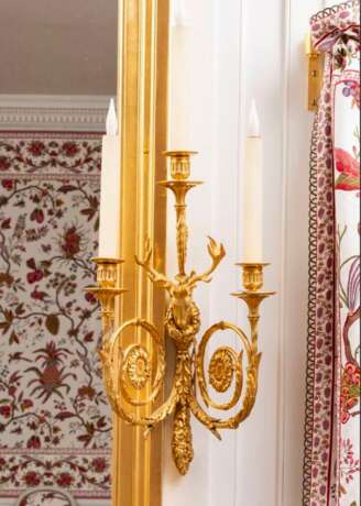 A SET OF FOUR LOUIS XVI ORMOLU THREE-LIGHT WALL-LIGHTS - photo 11