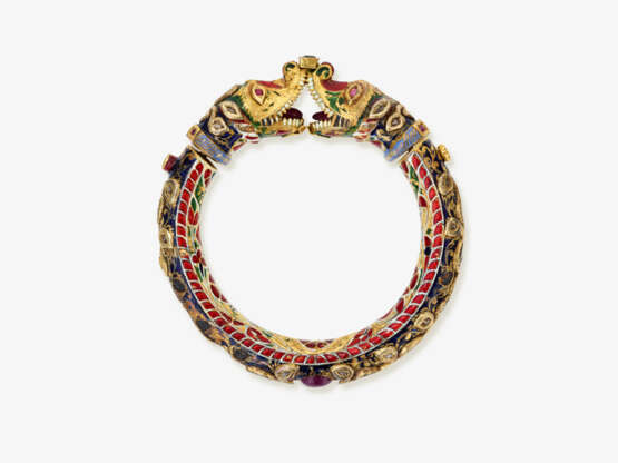 A bangle with dragon heads and diamonds, rubies, and enamel. India - photo 2