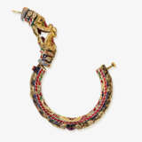 A bangle with dragon heads and diamonds, rubies, and enamel. India - photo 3