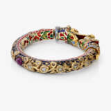 A bangle with dragon heads and diamonds, rubies, and enamel. India - photo 4