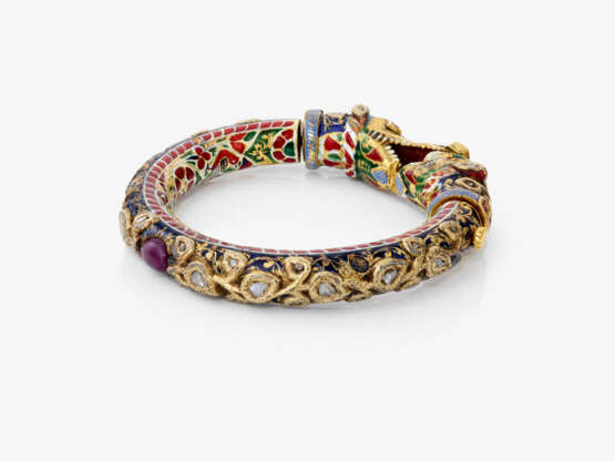 A bangle with dragon heads and diamonds, rubies, and enamel. India - photo 4