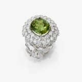 A ring with peridot and diamonds. - photo 1