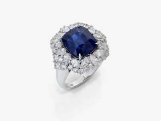 A ring with sapphire and diamonds.