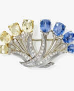 Dress jewellery. A sapphire and diamond brooch. LB, 20th century