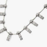 A necklace with fifteen diamond-studded links in geometric patterns. - photo 1