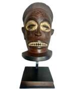Overview. Tchokw&eacute; mask from Angola in wood and pigments - Circa 1900