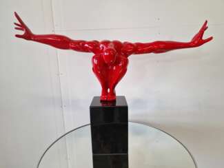 An elegant figure on a stone base