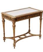 Glass. Carved showcase-table of gilded wood, in the spirit of Napoleon III, late 19th century. 