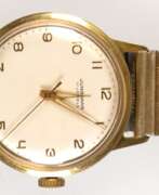 Montres. Herren-Armbanduhr &quot;Junghans&quot;, 17 Jewels, Handaufzug, 20 Mikron vergoldet, helles Zifferblatt mit arabischen Zahlen und zentraler Sekunde, Dm. 3,3 cm, gangfähig, flexibles goldfarbenes Armband