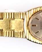 Montres. Damen-Armbanduhr &quot;Lanco&quot;, Handaufzug, 17 Jewels, Incabloc, Swiss made, ovales perlmuttfarbenes Zifferblatt mit Stabindizes, gangfähig, goldfarbenes Gehäuse, 2,2x1,8 cm, Gliederarmband, L. 16 cm