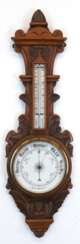 Barometer mit Thermometer, um 1900, Nußbaum, reich beschnitzt, 87x26 cm