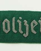 Armour and uniforms. 3. Reich: Ärmelband für Hilfskräfte der Polizei mit Offiziersrang.