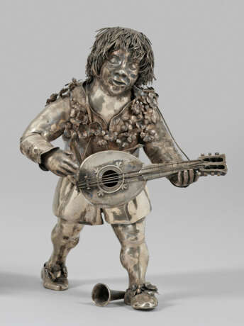 Ukulelenspieler Silber. Figur eines laufenden Ukul… - photo 1