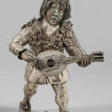 Ukulelenspieler Silber. Figur eines laufenden Ukul… - photo 1