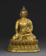 Bronze. A GILT-BRONZE SEATED FIGURE OF SHAKYAMUNI BUDDHA