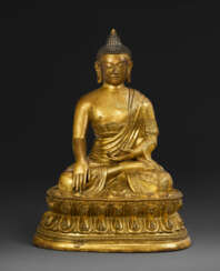 A GILT-BRONZE SEATED FIGURE OF SHAKYAMUNI BUDDHA