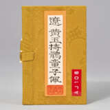 A RARE PALE YELLOW AND RUSSET JADE CARVING OF A BOY HOLDING A BIRD - photo 3