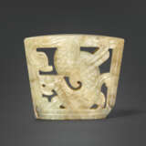 A RARE MOTTLED GREYISH-BEIGE JADE `WINGED DRAGON` CHAPE - photo 1