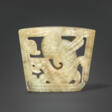 A RARE MOTTLED GREYISH-BEIGE JADE &#39;WINGED DRAGON&#39; CHAPE - Jetzt bei der Auktion