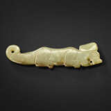 A GREYISH-GREEN JADE TIGER PENDANT - photo 1
