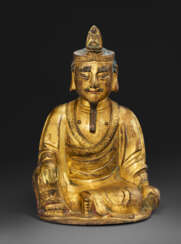 A GILT-BRONZE SEATED FIGURE OF GUANYIN