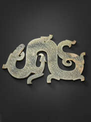 A GREYISH-GREEN JADE DRAGON PENDANT