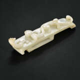 A WHITE JADE `CHILONG` SCABBARD SLIDE - photo 1