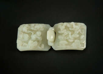 A RARE WHITE JADE &#39;ZODIAC ANIMALS&#39; TWO-PART BELT BUCKLE