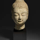A SMALL LIMESTONE HEAD OF BUDDHA - photo 1