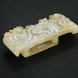 A RARE AND FINELY CARVED PALE GREYISH-WHITE AND BEIGE JADE SCABBARD SLIDE - photo 1