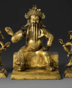 Медь. A GILT-COPPER REPOUSS&#201; FIGURE OF GUANDI AND TWO ATTENDANTS