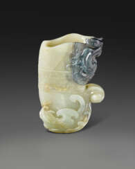 A SMALL WELL-CARVED PALE GREENISH-WHITE AND GREY JADE RHYTON