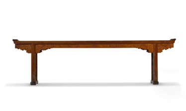AN IMPORTANT AND MASSIVE HUANGHUALI TRESTLE-LEG TABLE