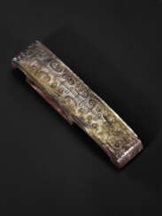A MOTTLED BLACK AND BROWN JADE SCABBARD SLIDE